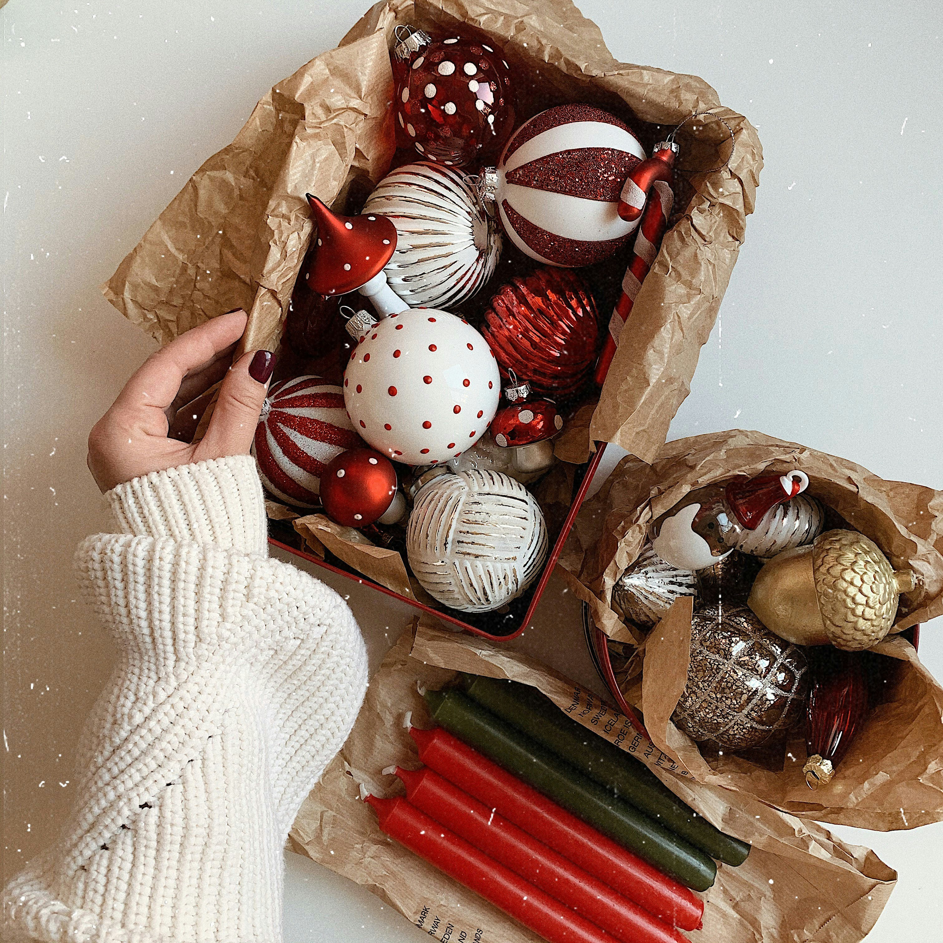 Ornaments in box with hand posing